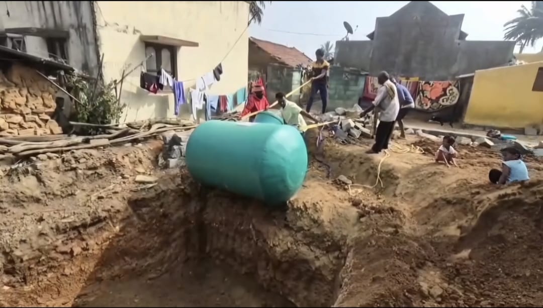 Team installing bio-septic tank at residential project